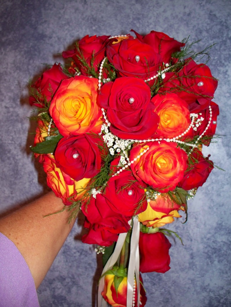 1128 CASCADING BOUQUET WITH RED/ORANGE ROSES W/PEARL ACCENTS